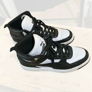Puma Rebound Joy 'Black White' sneakers.